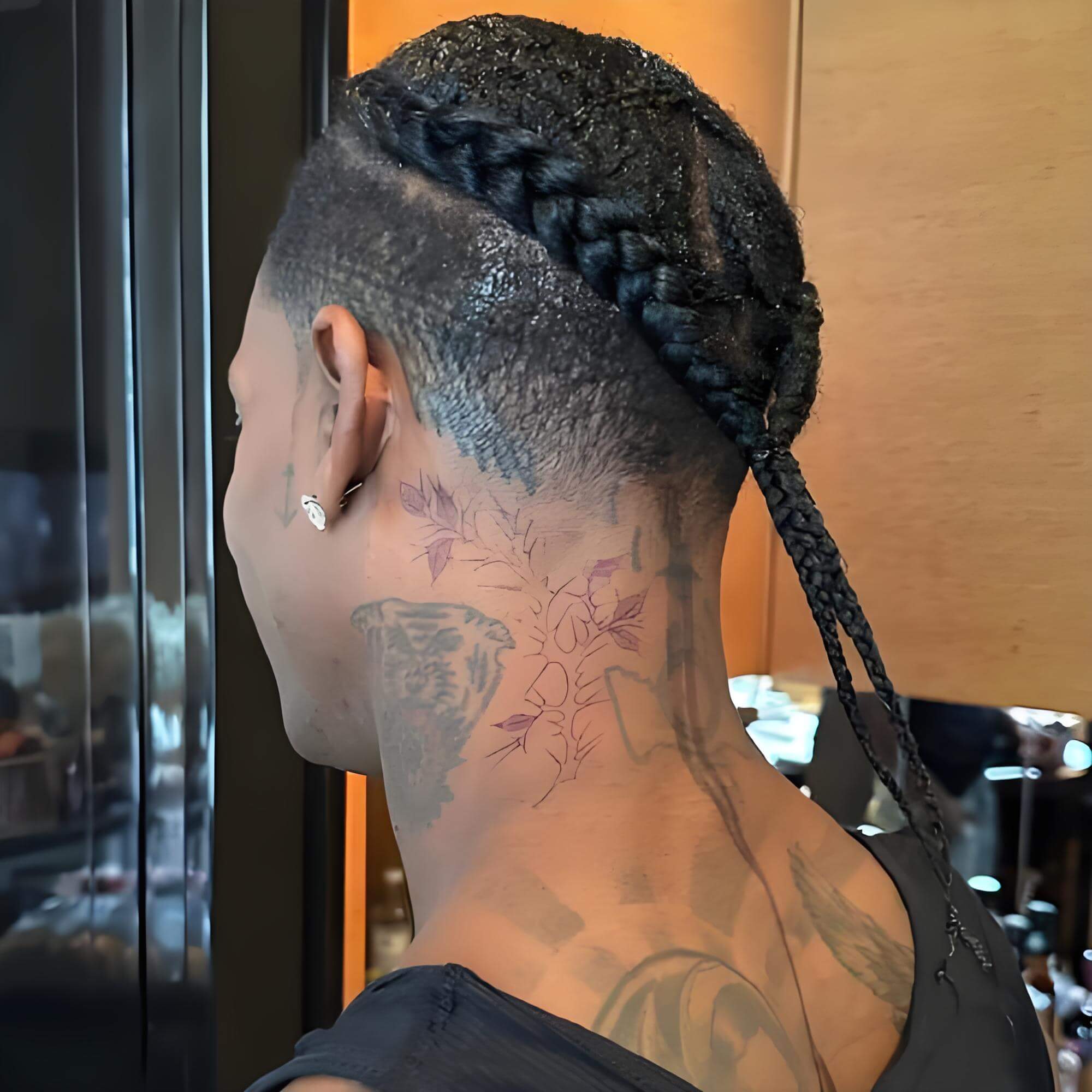 Travis Scott neck and arm tattoos