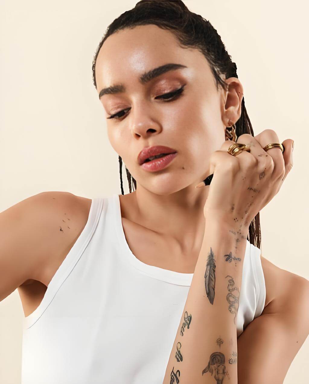 Zoe Kravitz minimalist word and dot tattoos