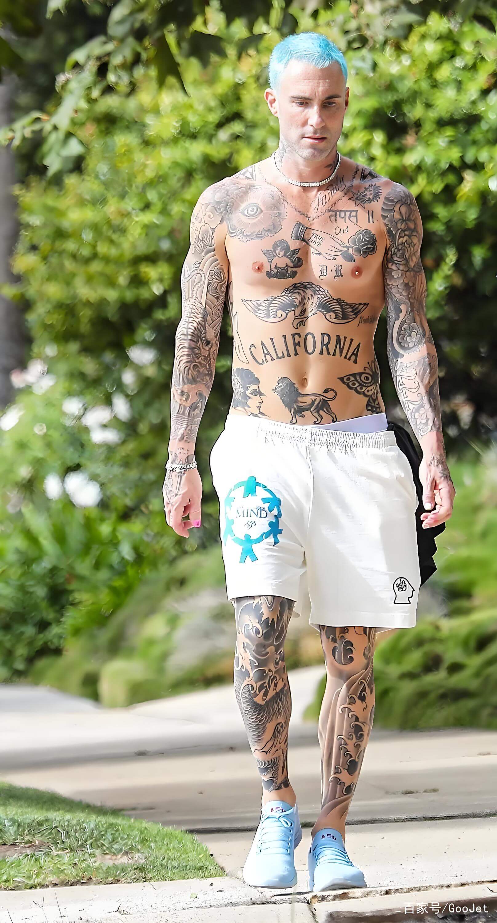 Adam Levine black floral sleeve tattoo